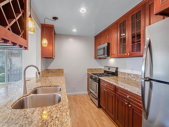 Gorgeous upgraded kitchen with granite countertops, stainless appliances, cherrywood cabinetry.
