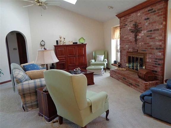 Great Room. Nice great room with skylights and a wood burning fireplace