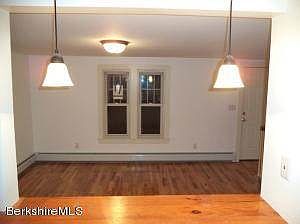 view from breakfast bar into dining