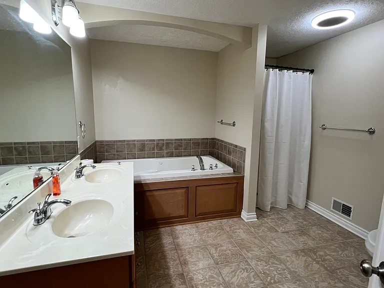 Primary bathroom with stand up shower & 6' jetted whirlpool tub!!