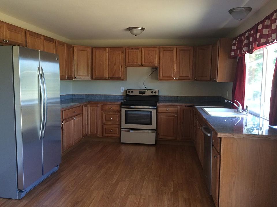 Kitchen with stainless appliances, new flooring and cabinets