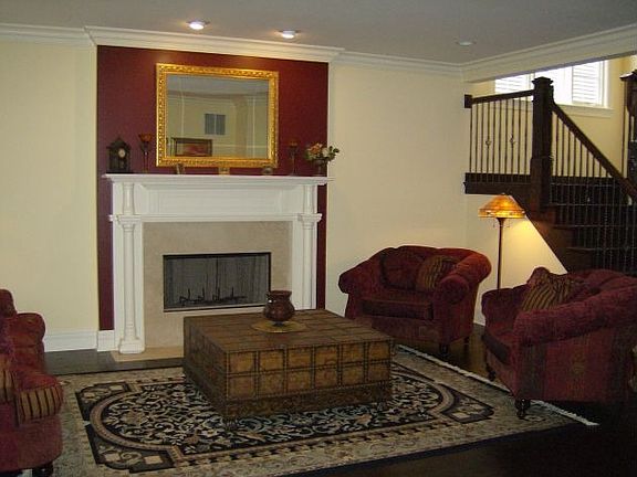 living rm with 1 of 3 fireplaces