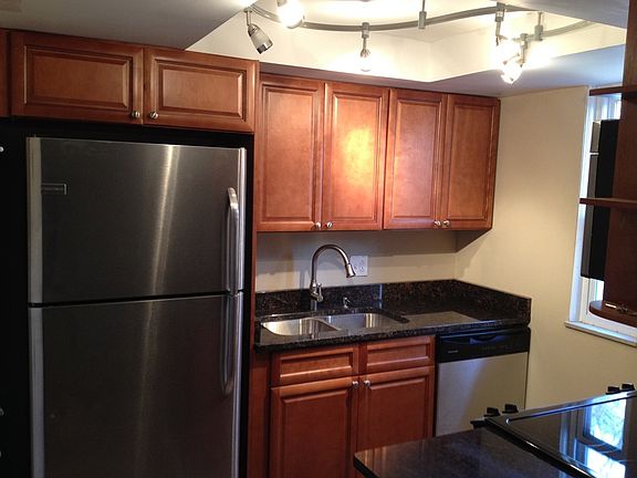 Kitchen w/ granite, cherry cabinets & stainless applainces