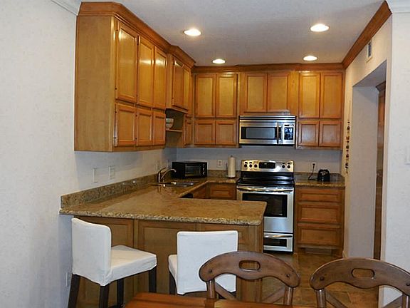 Kitchen offers a large breakfast bar. Great for entertaining.