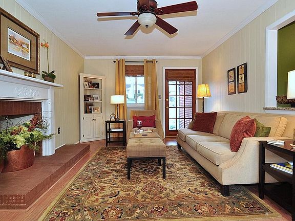Lovely den with fireplace and backyard access