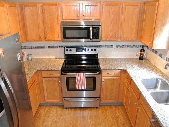 View of the Kitchen with Granite counters and combination ti