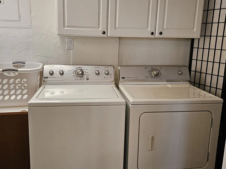Laundry room off the kitchen. Access to front patio from here.
