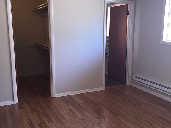 larger bedroom with walk-in and bathroom