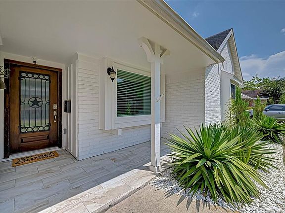 Covered patio at the entrance. Let's look inside!