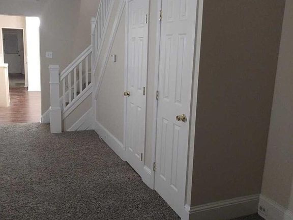 Powder room in living room and a small closet