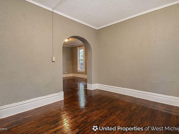 View from living / TV room to the main entrance area / dining room