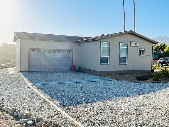 back of house with double car garage
