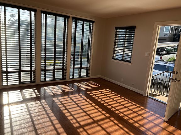 Living room with floor to ceiling windows.
