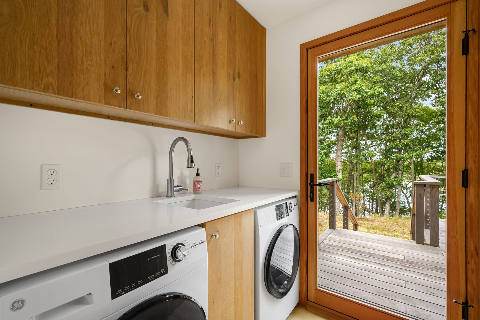  Laundry room with door to side deck