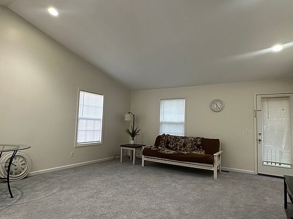 Great room with vaulted ceilings, opens to the kitchen