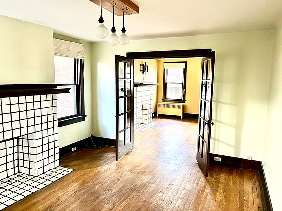 Large living and dining space with French doors