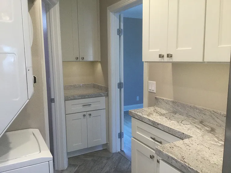 left door leads to the bathroom; door on right leads to bedroom