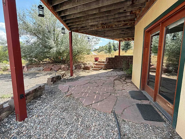 Front entry: garden level apartment with shaded outdoor area and parking space