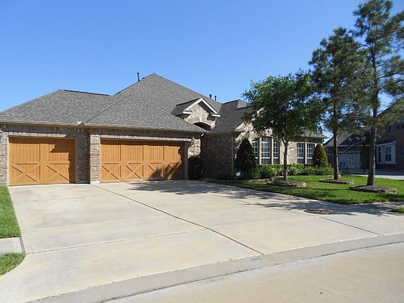 Notice the expansive drive, plenty of room for extra parking, 3 car garage with custom raised panels