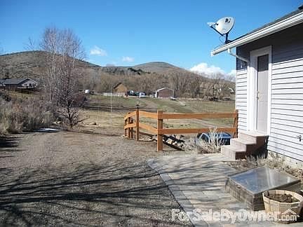 View from front porch to barn & shop