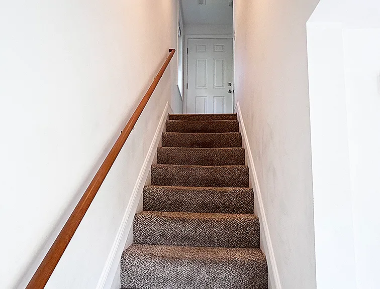 stairway from entry door up to living area.