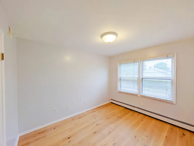 Secondary Bedroom 2 with new wood floor and new ceiling light