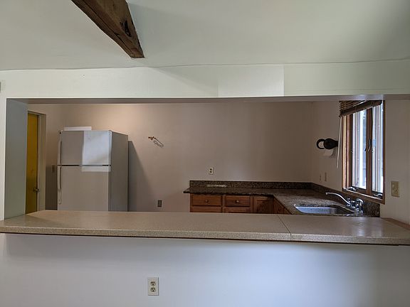 Kitchen with granite countertop.