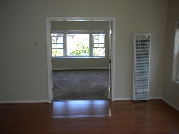 Open floor plan with large windows.