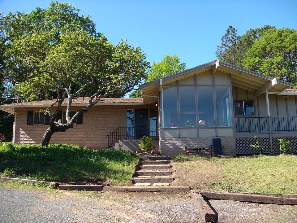 Front view of the house with large windows to take advantage