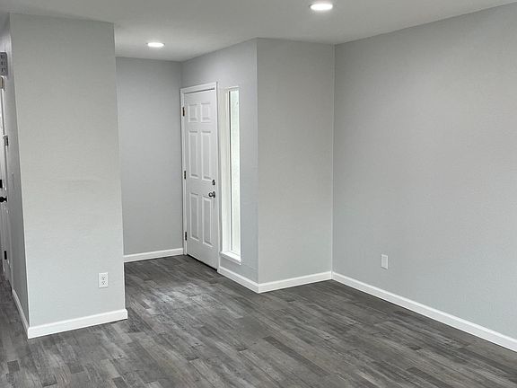 Entry with living room space (Partial View)