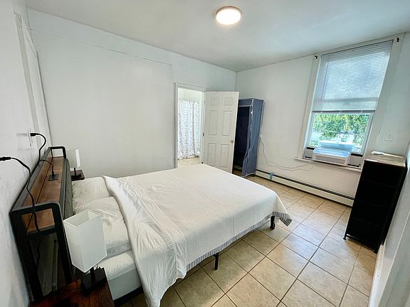 Master bedroom with a full bathroom