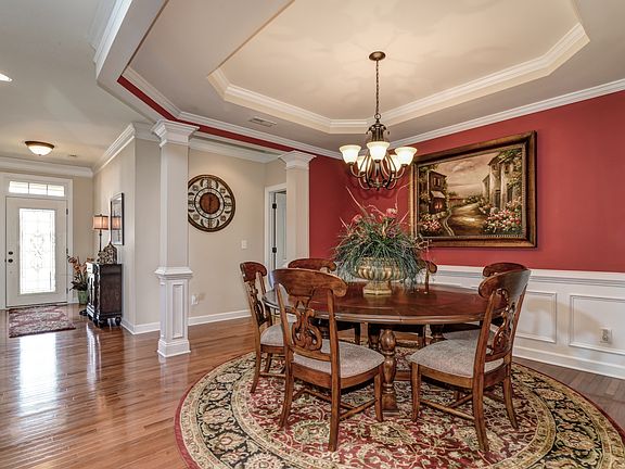 Dining room has tray ceiling