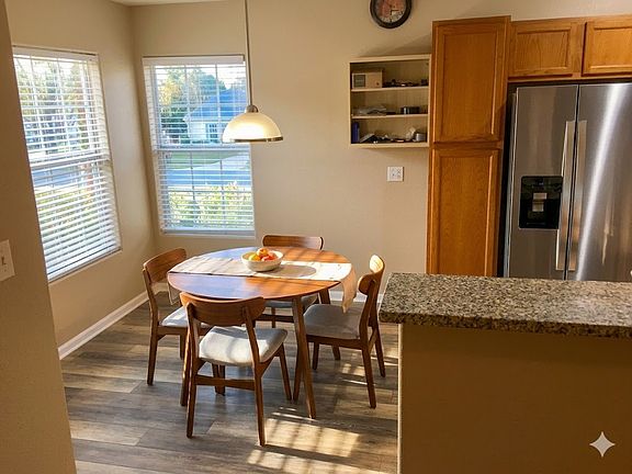Nice dining space right off the kitchen with lots of sunlight from the adjacent windows.