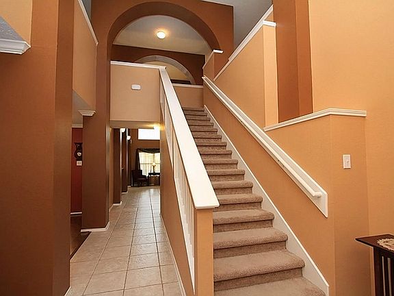 Passing through the front entrance one immediately experiences the spaciousness of this fine home. The ceramic tiled front foyer extends approximately 43 ft with an 8 x 23 ft area between the den and kitchen.