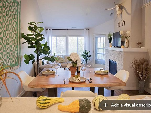 View from kitchen across dining area to living room.