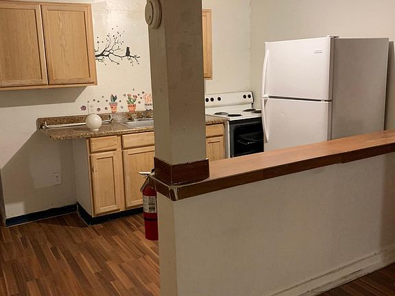 Full Kitchen, Cabinet with Sink, Range/ Oven, Refrigerator and Half wall