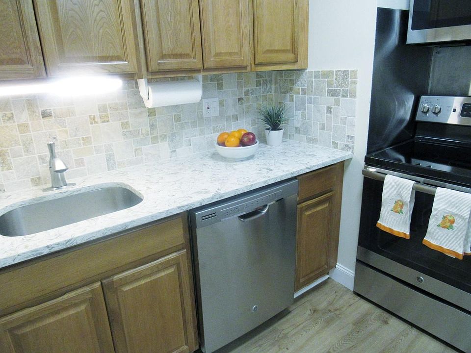 Full kitchen with stainless dishwasher, microwave, and stove