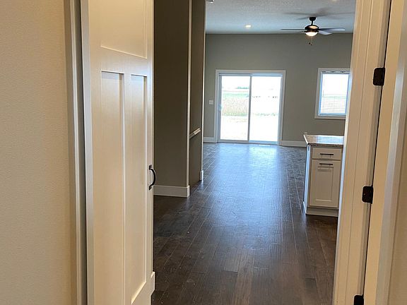 Looking in from the front door. Laundry behind barn door