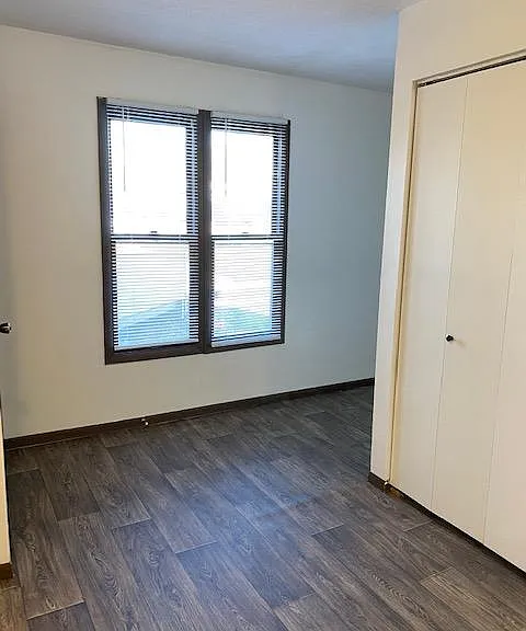 View from the eat in kitchen, front door on the left, kitchen pantry on the right.