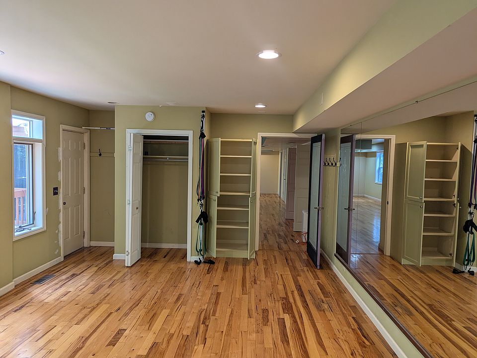 MIRROR/ WINDOW ROOM Showing built in cabinets and closet. The left corner of the room has a door that goes to a small private deck that is also off the FLORIDA PATIO ROOM