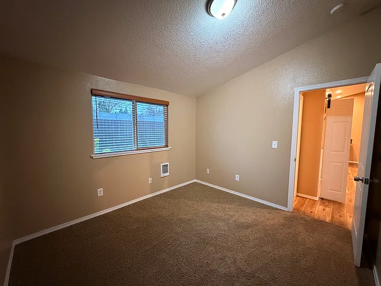 Bedroom with High Ceiling and Large Window!