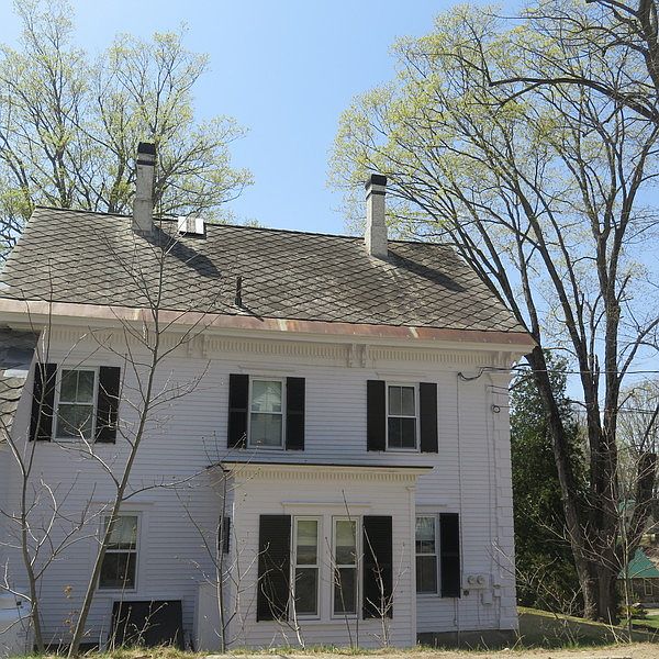 Back of building view : Two chimneys- one non-working/ one working
