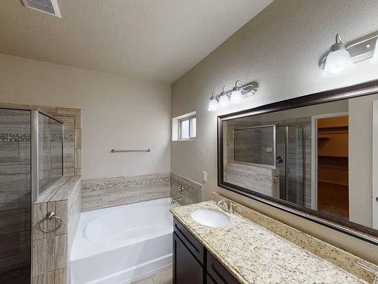 Elegant Primary Bath with Garden Tub and Walk-In Shower
