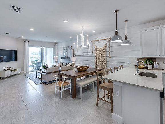 Cafe dining adjacent to kitchen and gathering room