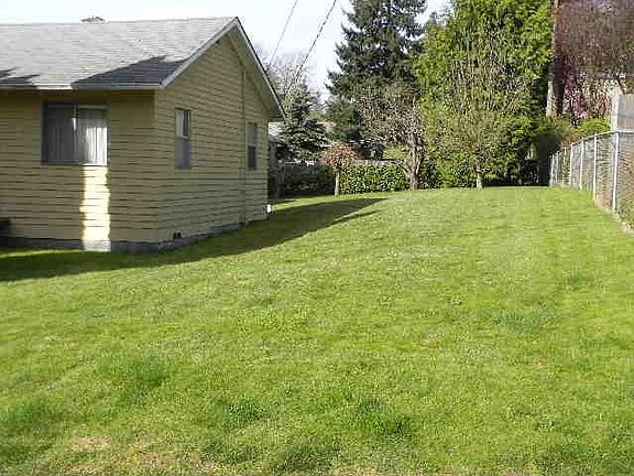 Large side yard offers room to play or possible expansion.