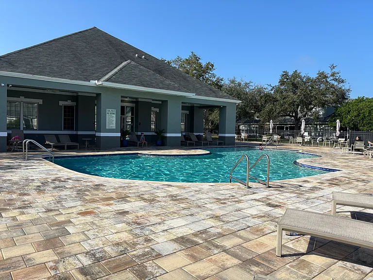 Sit poolside and relax just a few steps away from the condo!