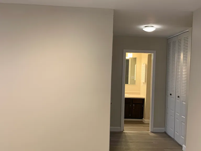 Bright/wide pathway to the hallway to bathroom