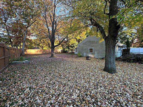 Fully fenced in back yard with shed in the back.