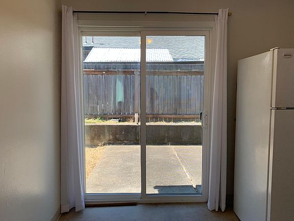 Patio (sliding door entrance to Kitchen/Dining areas)