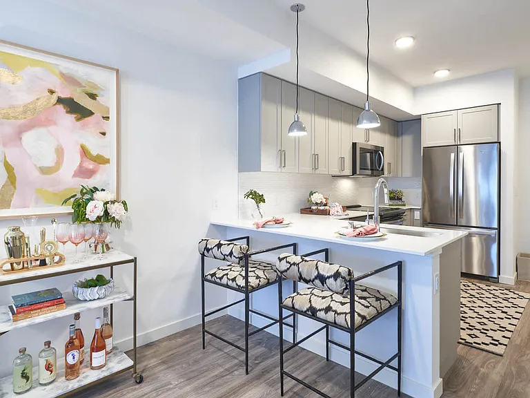 Kitchen with Breakfast Bar and Stainless Steel Appliances